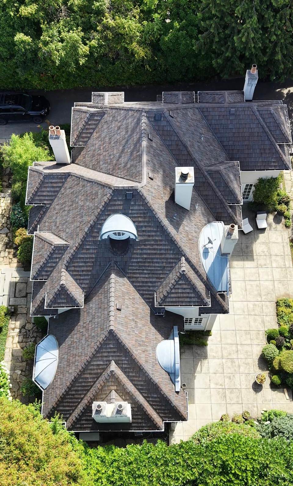 Overhead view of a Vancouver west-side home roofed in Brava composite shake, showing dormers, hips and valleys